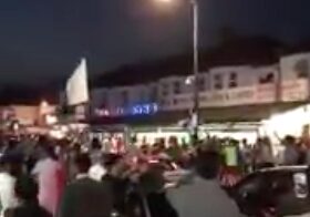 Police Officer Responding To A Fight Breaking Out Among A Large Group Of People  Suffers A Head Injury
