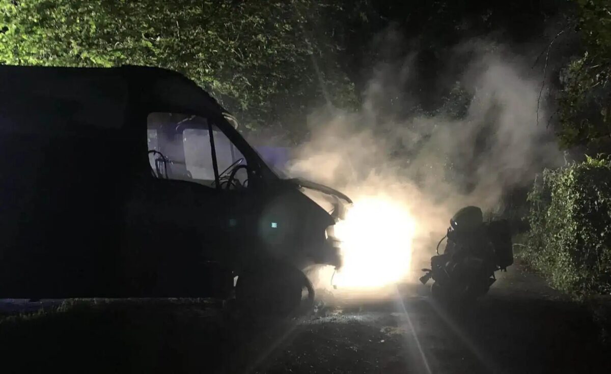 Firefighters, wearing breathing apparatus  with two high-pressure hose reels, quickly brought the blaze under control after the arson attack