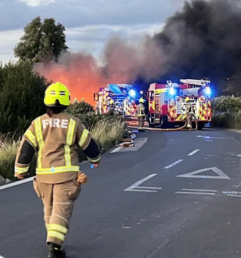 Blazing Heat Triggers Massive Grass Fire in Slade Green – Firefighters Swiftly Extinguish Flames