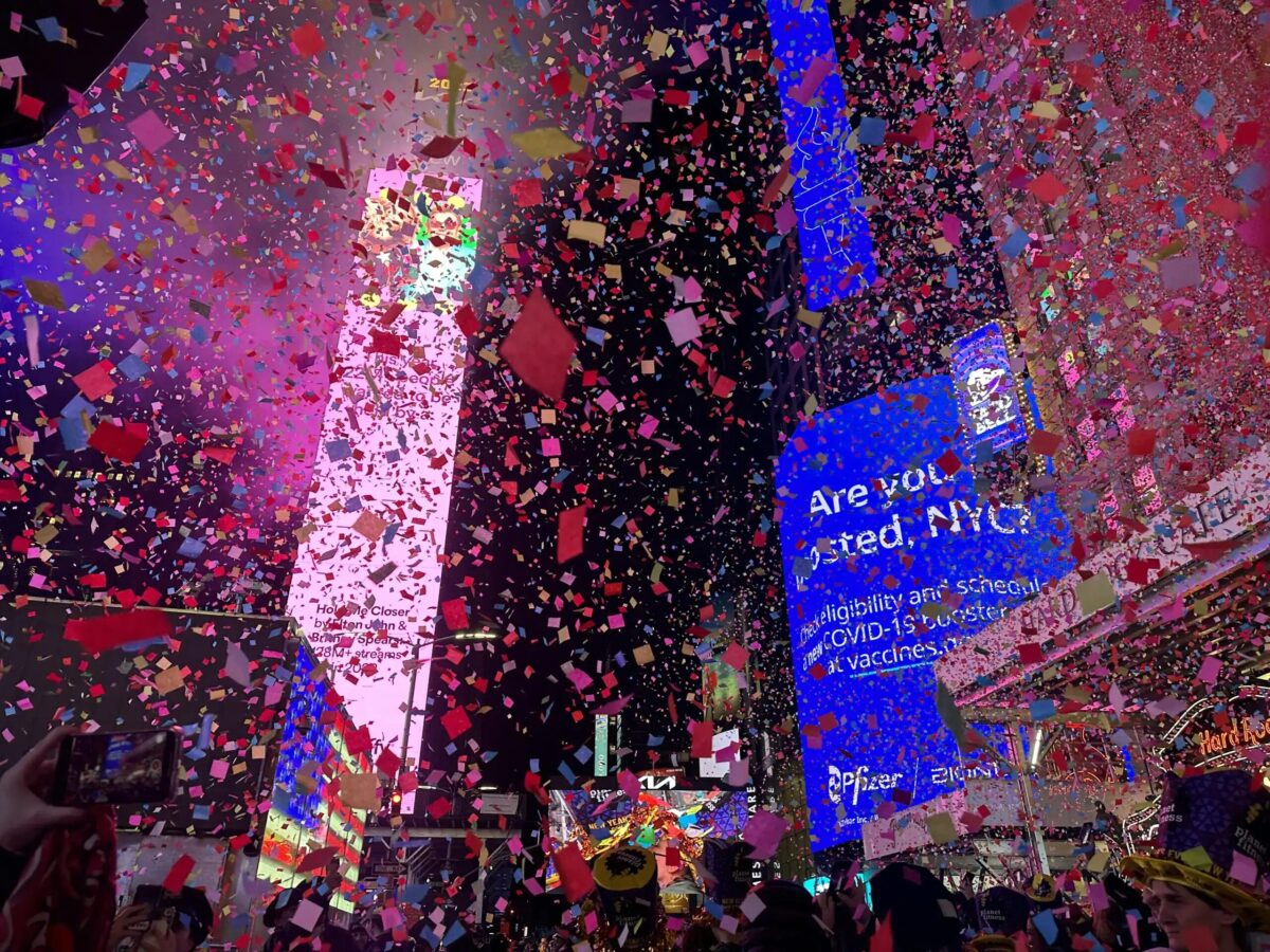 Thousands flocked to Times Square to watch the ball drop for the first unrestricted New Year’s Eve party since 2020, despite the gloomy and misty weather