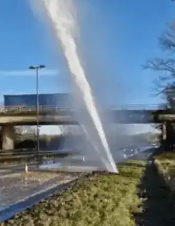 Police close major road after burst water main