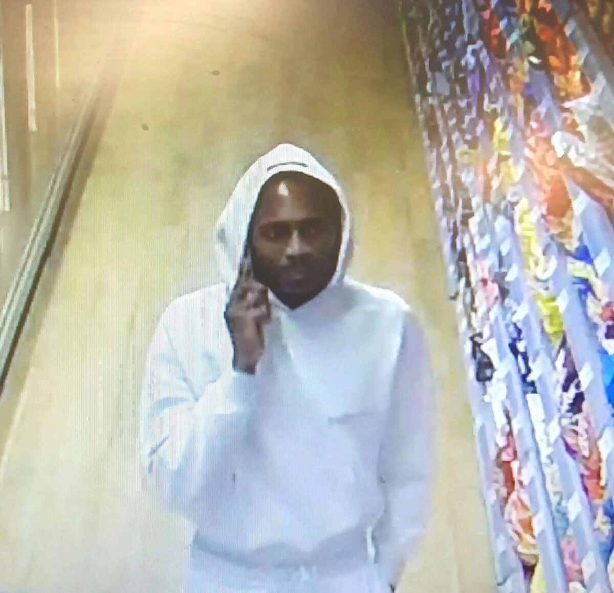 Crawley Assault: Police Search for White Tracksuit Man Grabbing Weapon from Car Boot in Co-op Attack