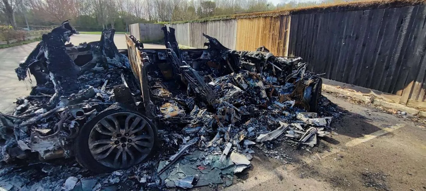 Crawley Rugby Club Car Blaze: Police Hunt Dark-Clad Suspect Fleeing Scene