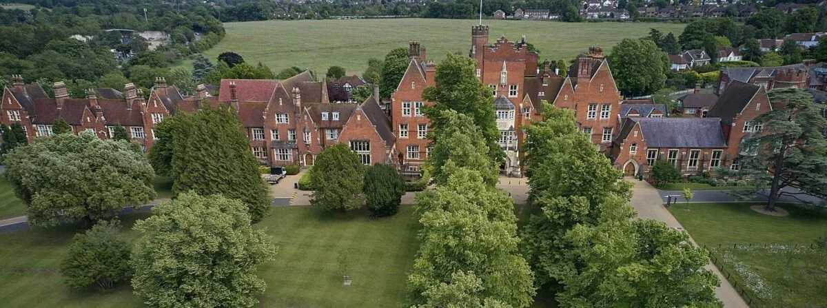 Triple Murder Probe at Epsom College: Family Found Dead with Licensed Firearm, Police Boost Patrols