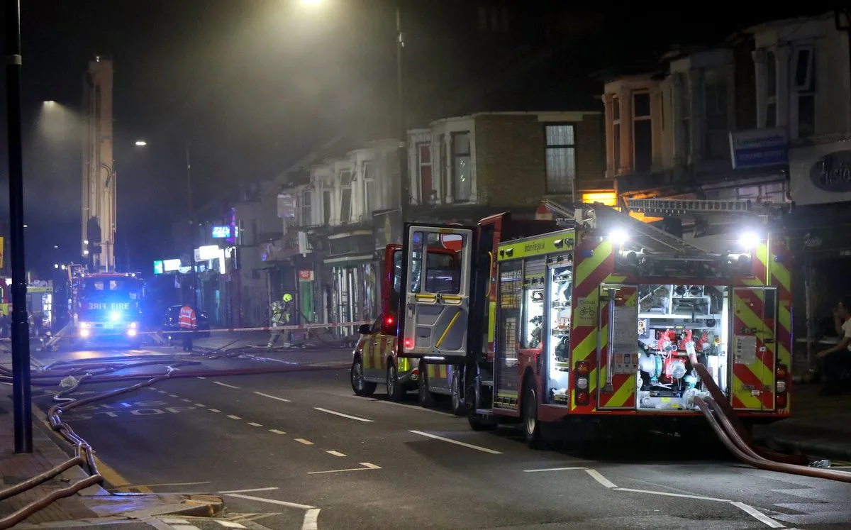 Fifteen fire engines and around 100 firefighters are currently attending a fire at a range of shops on Sherrard Road in Newham