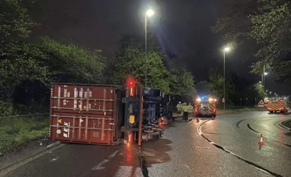 A lorry driver had to be rescued after a container lorry overturned in Totton