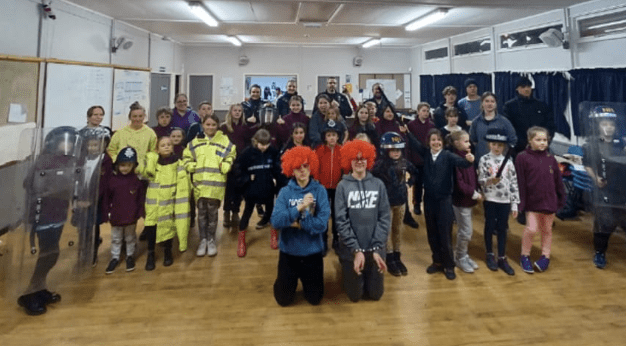 A Scout Troop Of Young Children Dressed Up Like The Police And Got To Meet Some Real-life Officers During A Surprise Visit