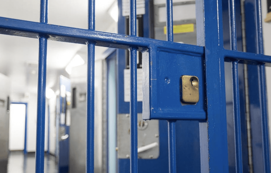 A woman to appear in court on charges related to the stabbing of a man inside a house