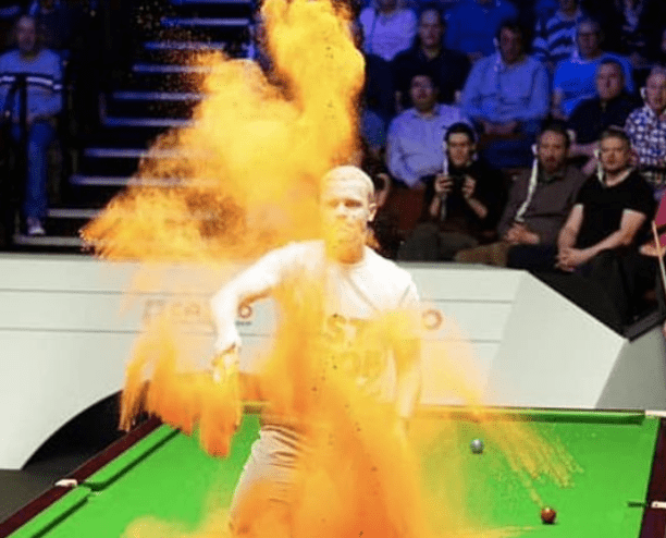 A Just Stop Oil Protester Threw Orange Powder Paint Over A Snooker Table During A World Championship Game, Causing The Match To Be Cancelled