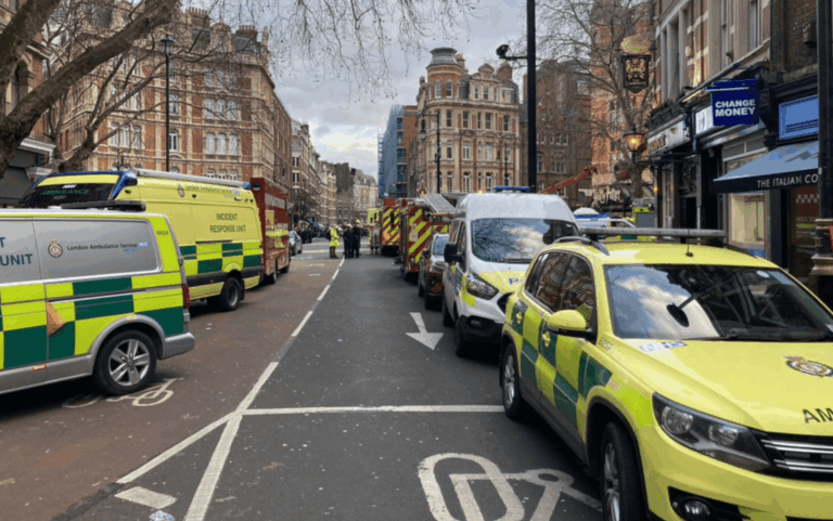 A man was trapped beneath a hydraulic urinal below street level in central London, and firefighters were called