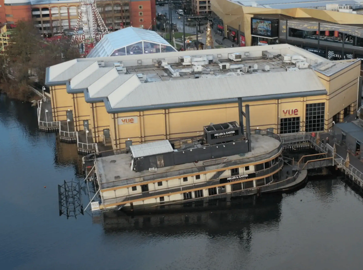 A floating restaurant has partially submerged in Lakeside shopping centre
