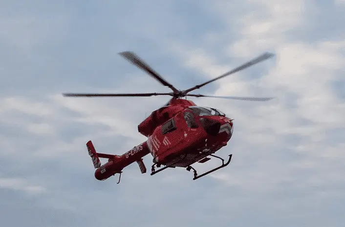 A man stabbed in the leg outside a shopping centre has been rushed to hospital