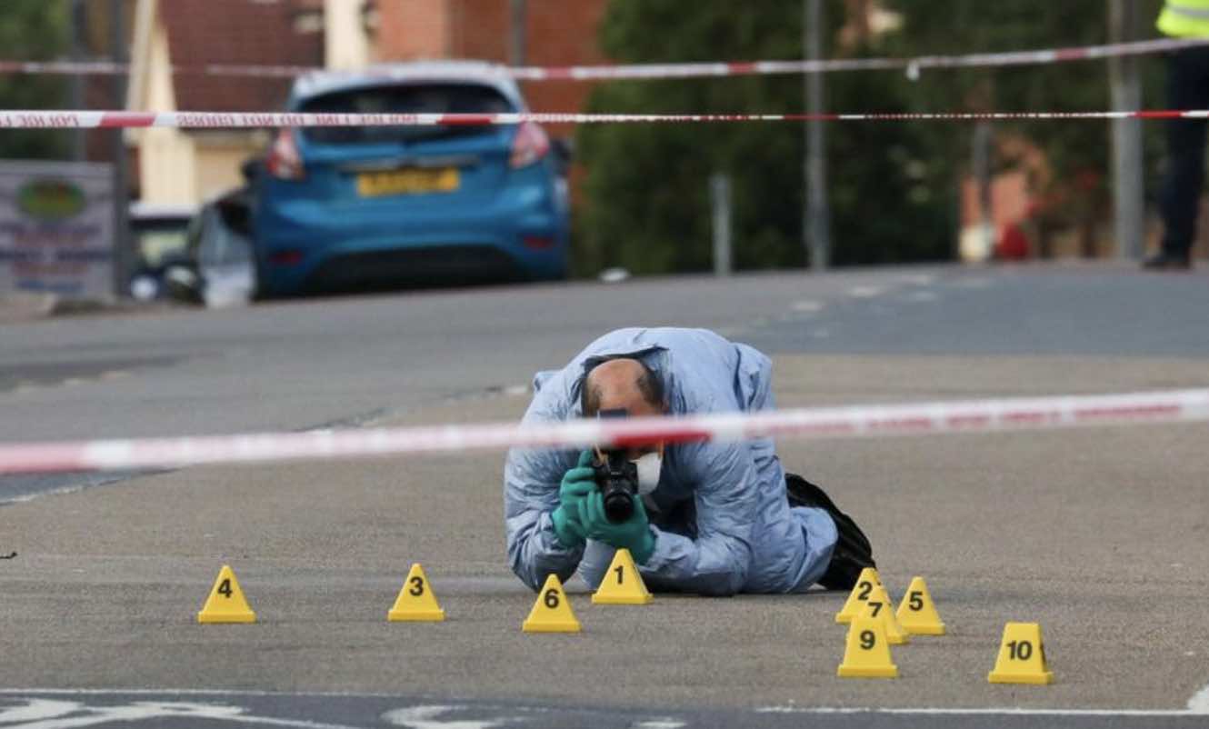Two Arrested After Man Is Gunned Down On Crossing  In Broad Daylight Shooting Yards From Primary School  In Mordon