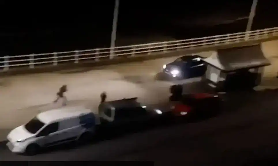 Following a “disgraceful” incident in which a car was driven towards pedestrians on a seafront promenade, three men were given suspended sentences