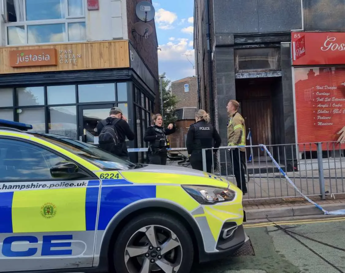 Firefighters were called after rubbish was set ablaze in a Portsmouth alleyway