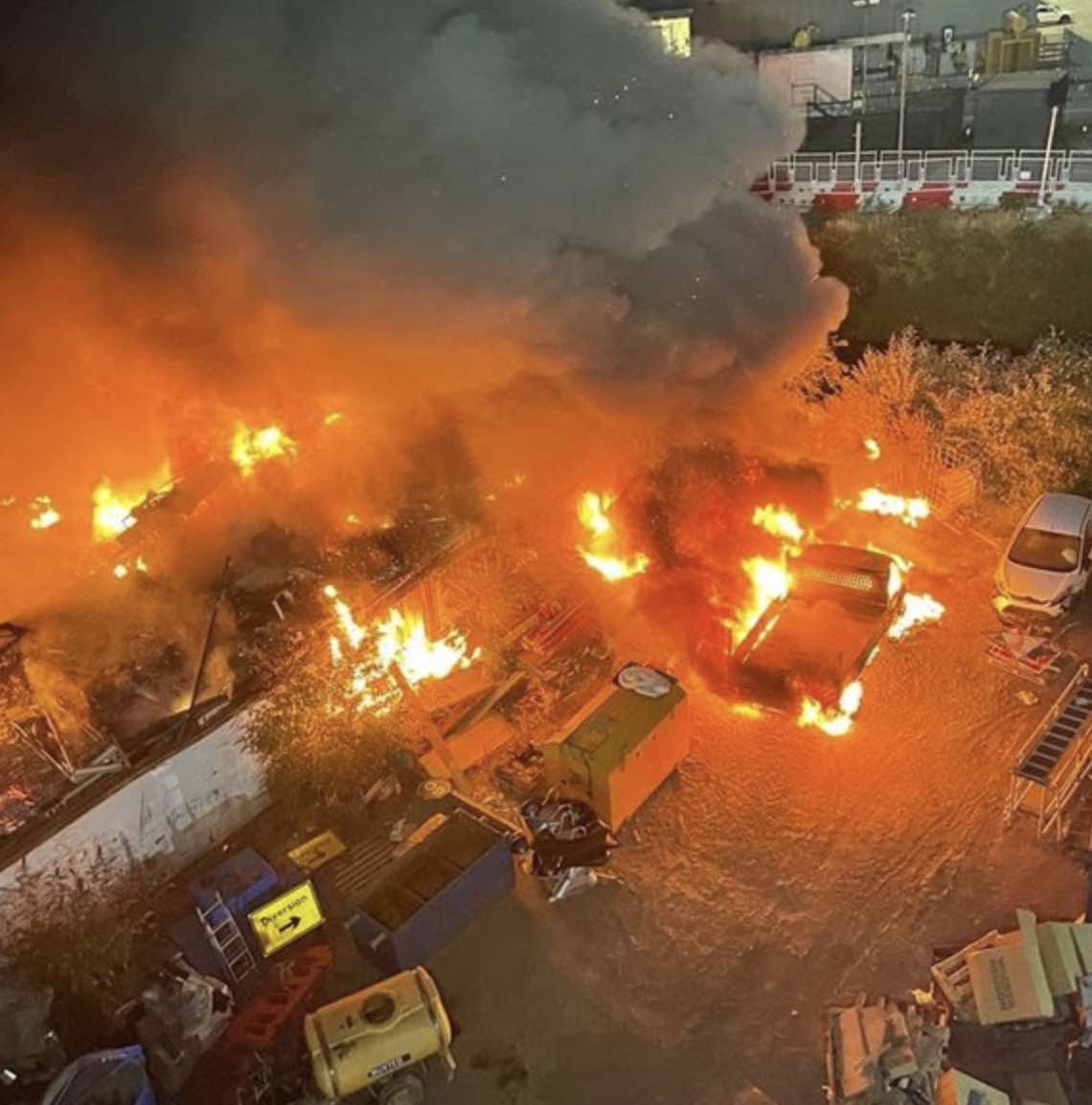 Fire Damaged Fifteen Shipping Containers Measuring 20 Metres By 50 Metres. A Car, As Well As An Arctic Lorry And Trailer, Were Destroyed.