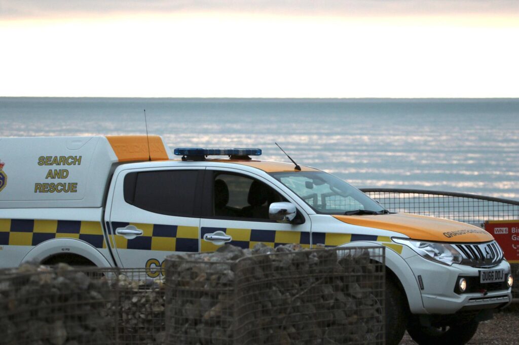Surfers loose a board whilst rescuing persons cut of by the tide below the Seven Sister’s