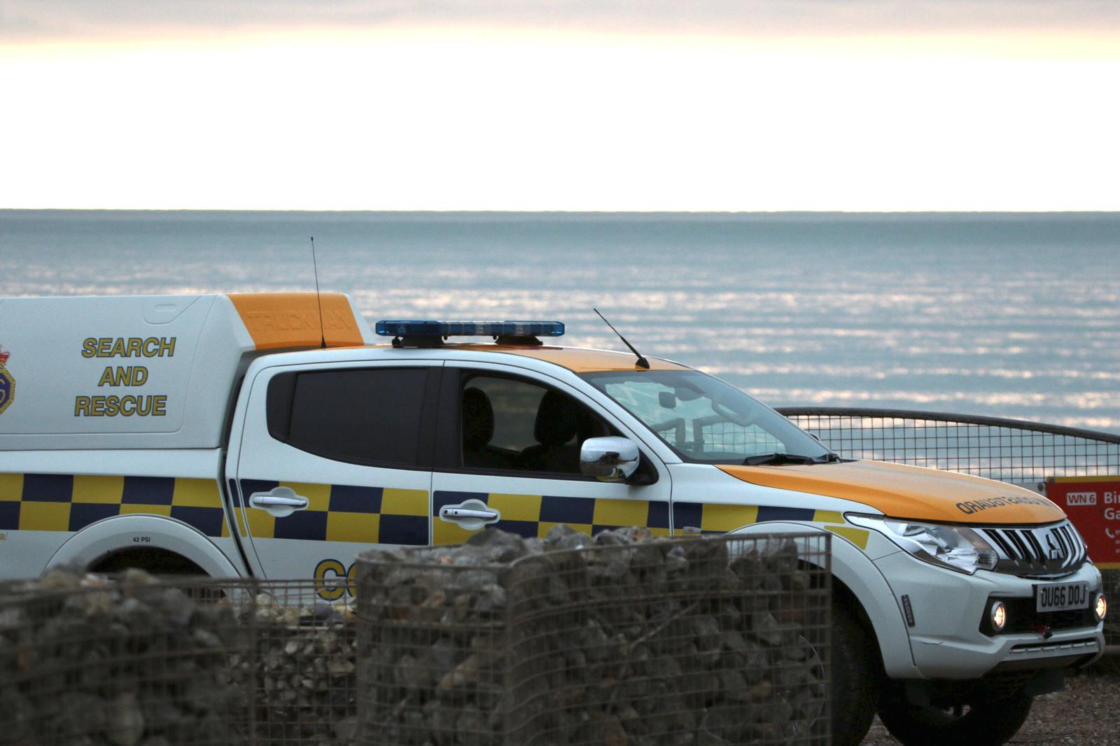 Surfers loose a board whilst rescuing persons cut of by the tide below the Seven Sister’s