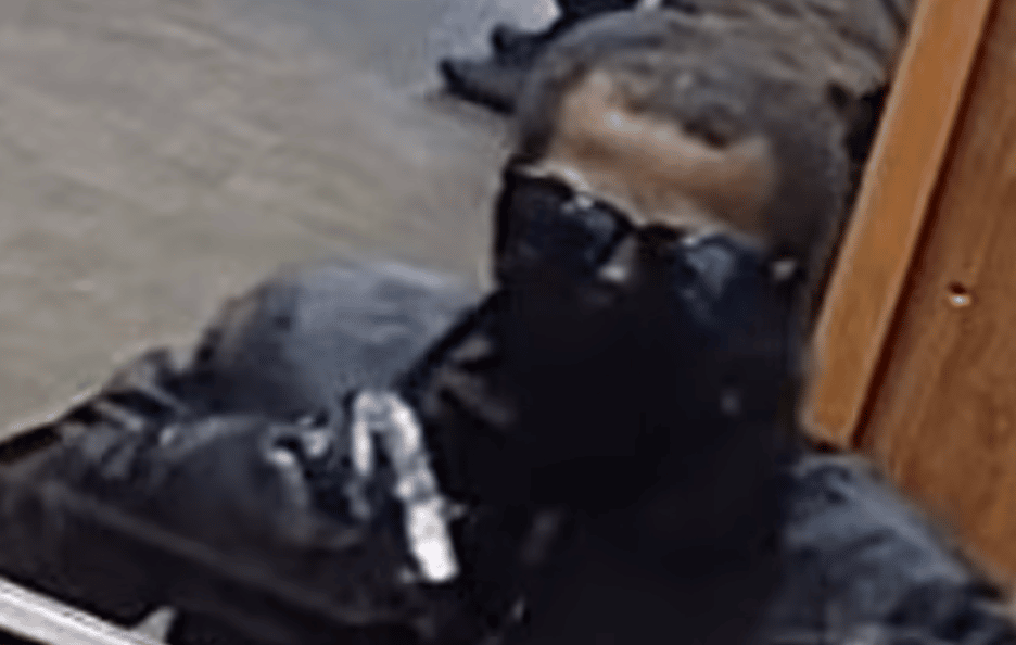 Detectives Looking Into An Armed Robbery At A Croydon Bookmaker Have Released Images Of A Man They Want To Identify