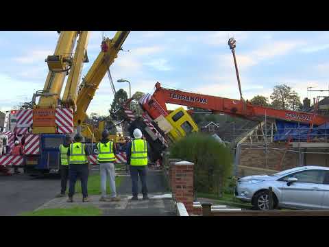 Crane Collapses Onto Building Leaving Person Trapped