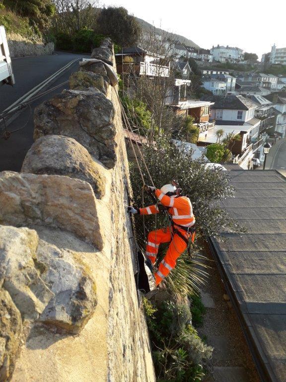 Specialist On Ropes  Called In To Help Island Roads Maintain Structures