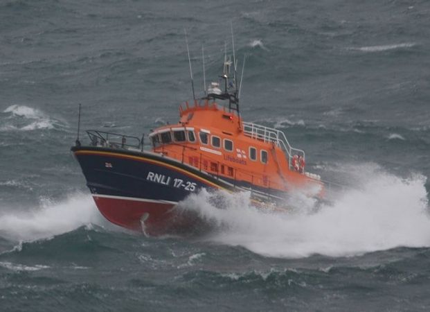 Three Rescued From Overturned Dinghy
