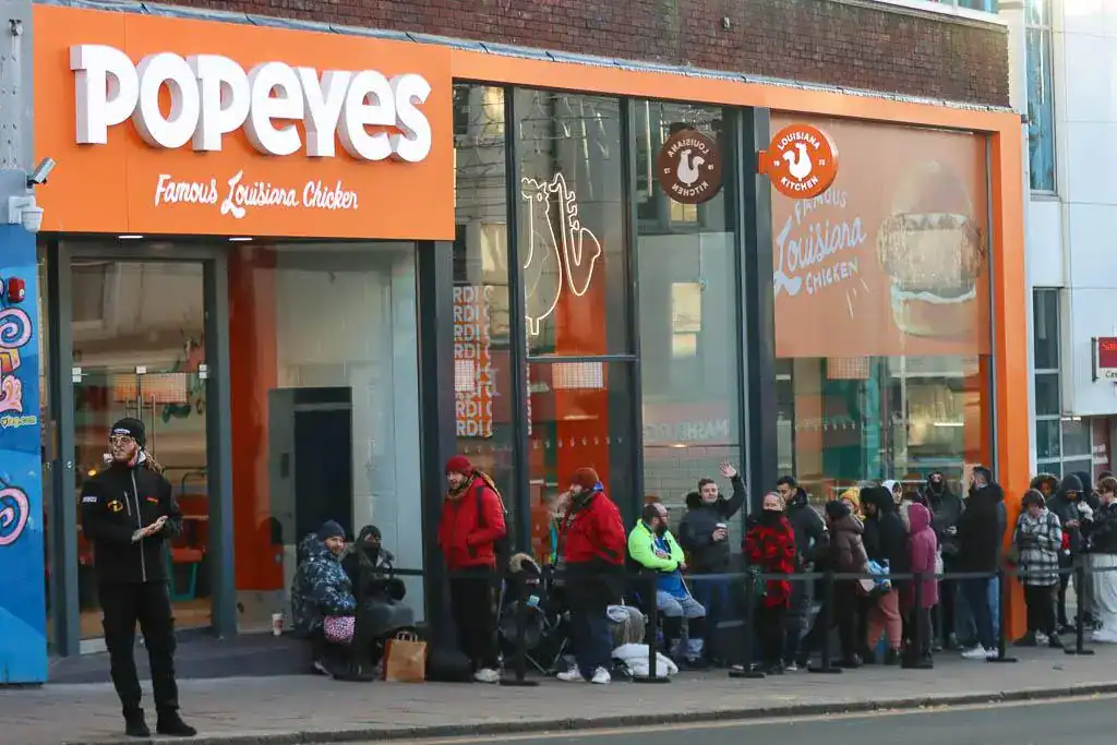Freezing Brits Queue for Hours as Popeyes Opens in Brighton with Year’s Supply of Free Chicken Up for Grabs!