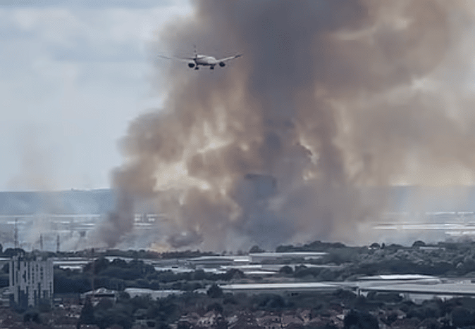 A Grass Fire Involving Gas Cylinders  on Hatton Road In Feltham Is Being Fought By 15 Fire Engines And Approximately 100 Firefighters