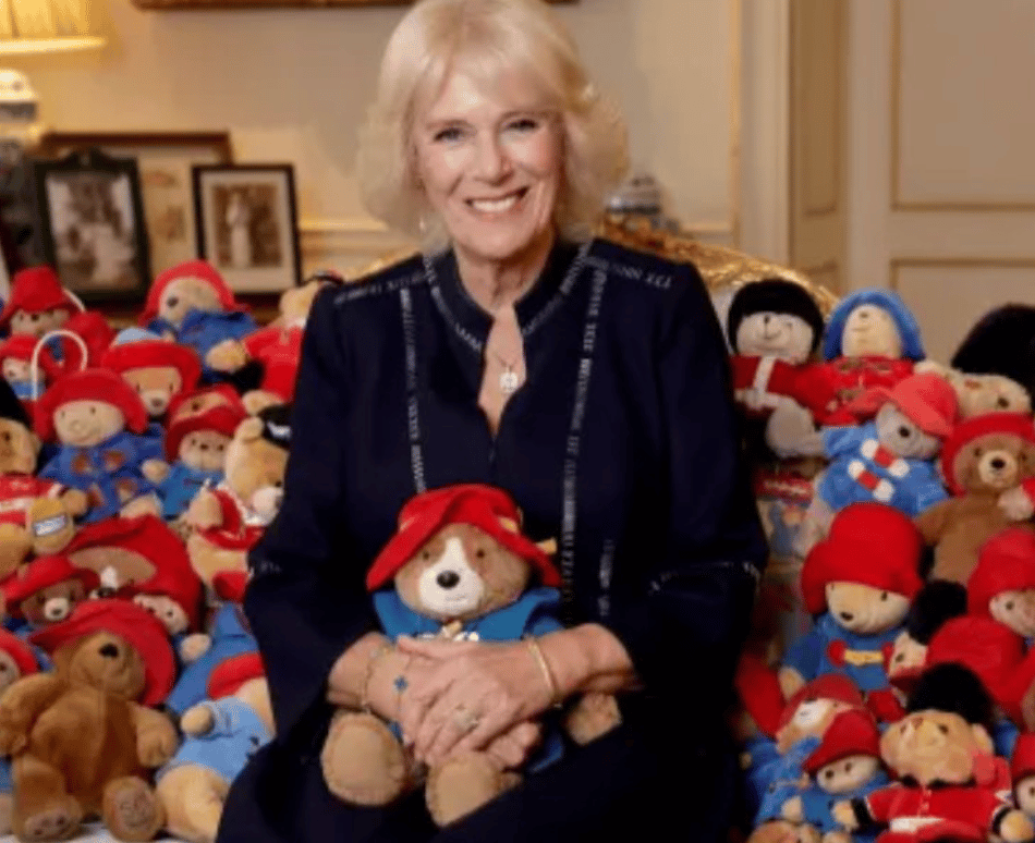 The Queen Consort is pictured surrounded by teddies in a new image released to mark the donation of more than 1,000 toy bears to the Barn…