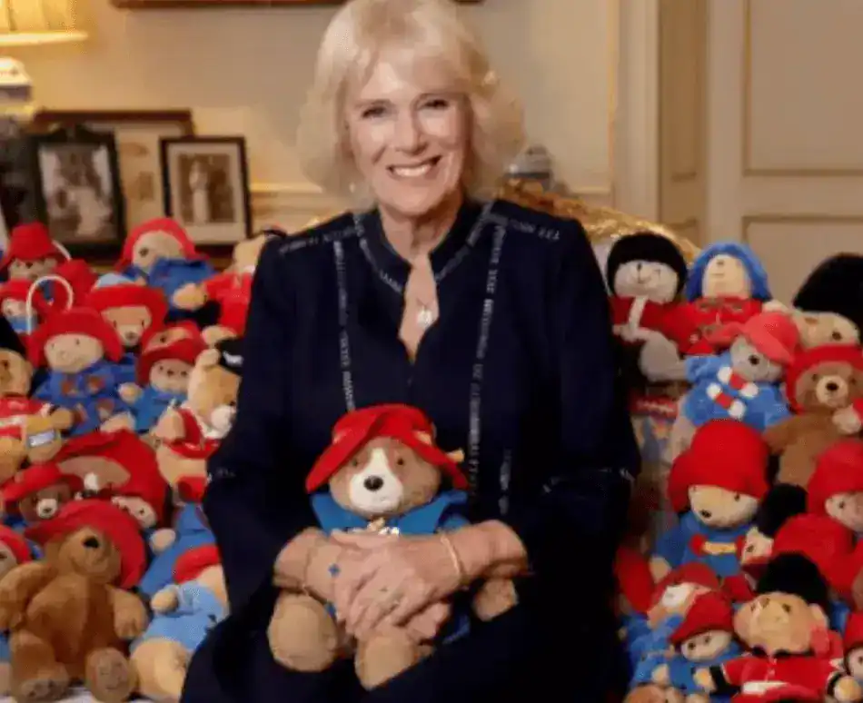 The Queen Consort is pictured surrounded by teddies in a new image released to mark the donation of more than 1,000 toy bears to the Barnardo’s children’s charity