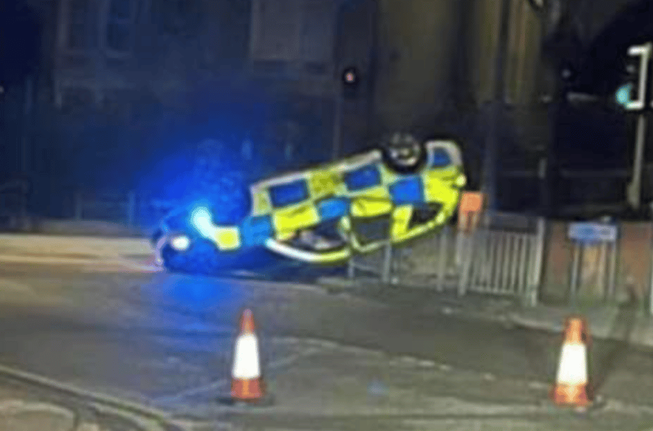 Two Police Officers Were Taken To The Hospital After Their Patrol Car Crashed And Landed On Its Roofs In Gravesend