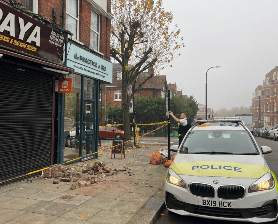 A mother and her child rushed to hospital after a wall collapsed in West Hampstead