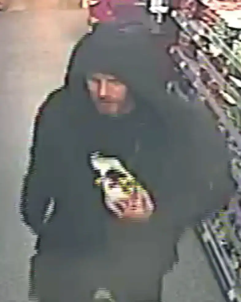 A man in his fifties was pushed to the ground by two people and had his wallet containing bank cards stolen