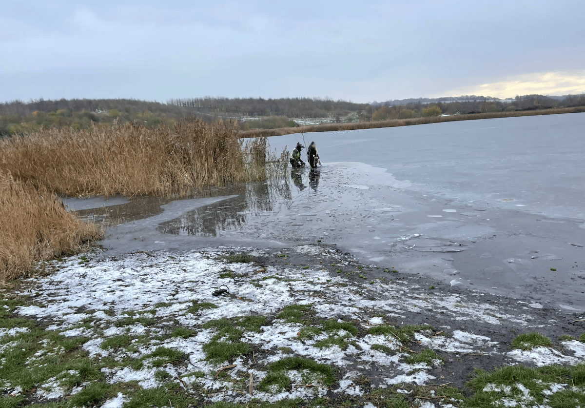 Officer Wades Through A Frozen Lake To Save Local Dog