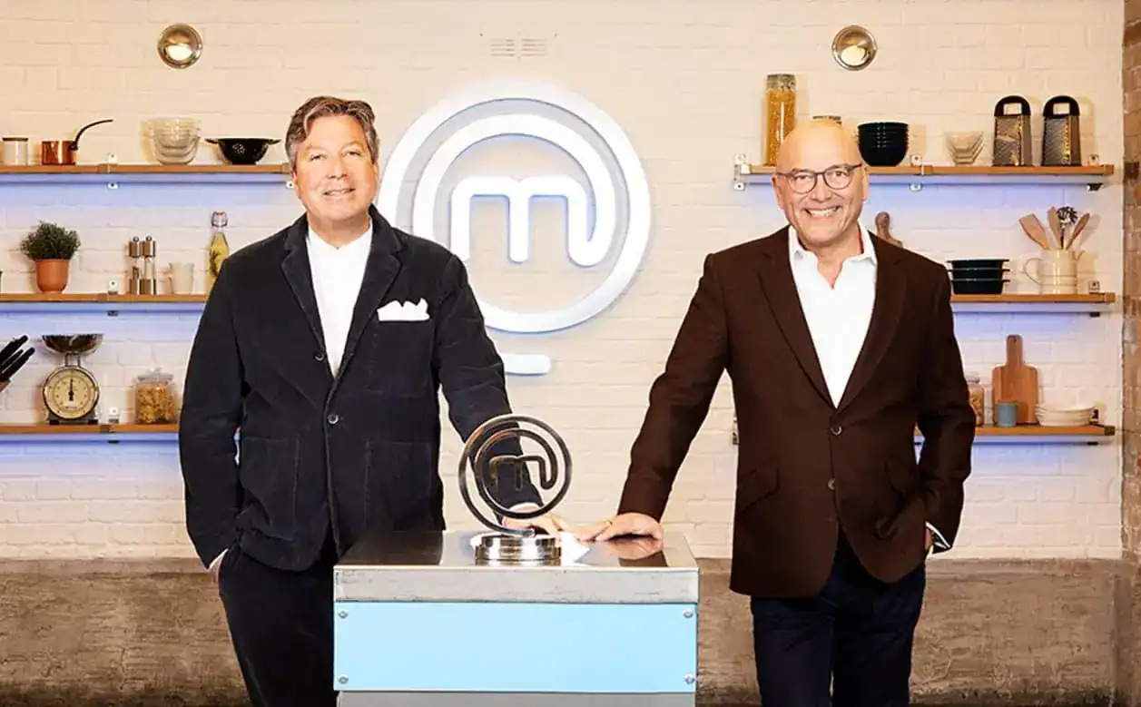 Celebrity MasterChef returns to BBC One this summer with an all-star line-up of comedy legends, world champion sporting heroes, multi award-winning musicians and stars of screen and stage who will be battling it out for the coveted Celebrity MasterChef 2022 title. John Torode MBE and Gregg Wallace MBE will be once again putting 20 well-known faces to the test across six weeks. They’ll discover who has the palate and skill to chop, slice and sizzle their way to lifting the iconic Celebrity MasterChef trophy. The celebrities hoping to tickle John and Gregg’s tastebuds and follow in the footsteps of last year’s champion, Team GB Paralympian Kadeena Cox, are: TV presenter and actor, Adam Pearson; former World Boxing champion, Chris Eubank; actor, Clarke Peters; actor, Cliff Parisi; musician and TV Judge, Danny Jones; reality TV star, Faye Winter; TV presenter and musician, Gareth Malone OBE; former pro-footballer, Jimmy Bullard; comedian, Kae Kurd; professional dancer, Katya Jones; TV presenter Kirsty Gallacher; British drag performer, Kitty Scott-Claus; actor, Lesley Joseph; TV presenter, Lisa Snowdon; musician, Mel Blatt; media personality, Nancy Dell’Olio; actor and comedian Paul Chuckle; reality star, MoJo; actor and comedian, Richard Blackwood and actor, Ryan Thomas. Following on from a hugely successful MasterChef final earlier this year, Celebrity MasterChef features four heat weeks concentrating on whittling down the celebrities; testing their abilities until only the best go through to the final stages. The series will once again feature an array of cookery challenges designed to stretch the celebrities’ culinary ability to their limits including the returning challenges in the heat rounds; Under The Cloche, The Street Food Challenge and Dinner Party Dish. Then the top celebrity cooks face the nerve-racking and exhilarating challenges during the Semi and Final Week stages. Post pandemic, this series sees our Semi-Finalists and Finalists face challenges cooking for large numbers of people including a special centenary challenge to mark 100 years of the BBC. Katie Attwood, MasterChef Series Editor, says: “Celebrity MasterChef is a firm favourite in the television must-see calendar and this series is as funny, engaging and nail-biting as ever. John and Gregg are in for a treat, as are our viewers.” Sarah Clay, Commissioning Editor for the BBC, says: “This line up will absolutely cement Celebrity MasterChef as one of the nation’s most loved cookery programmes, with a lot of laughter alongside fierce competition guaranteed. The level of cooking is fantastic this year and you can really see how much it means to them all.”