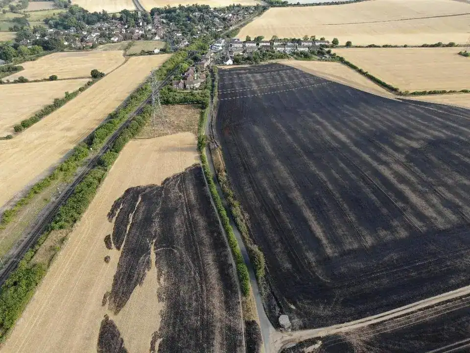 Huge Blaze Destroys 400 Acres and Roof of Vacant Building Near M11—Firefighters Battle Through the Night