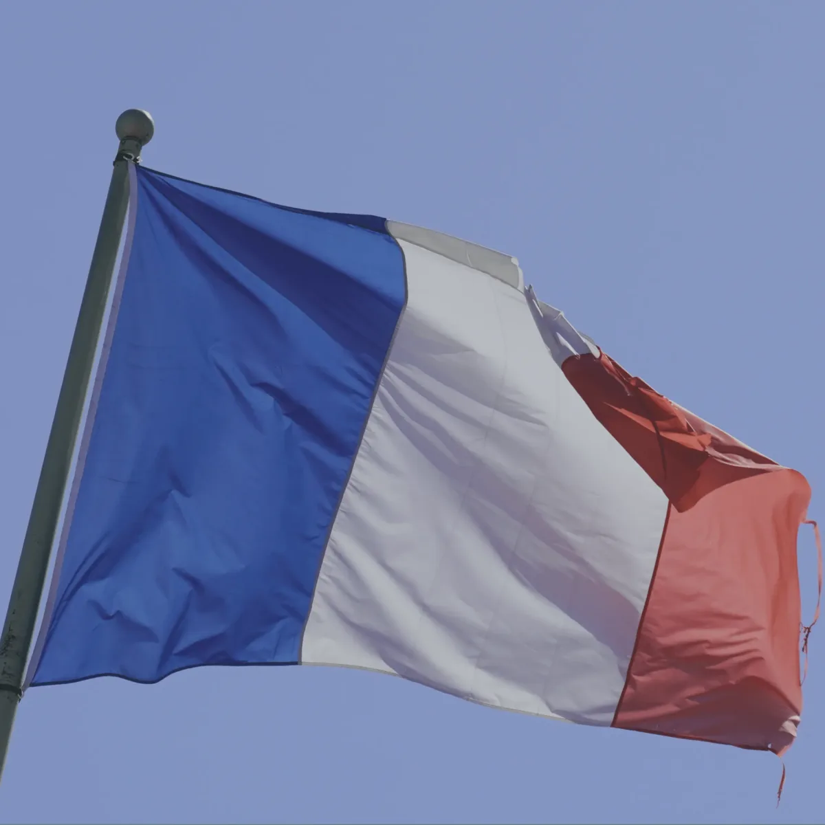 France Mourns Slain Teacher as Macron Calls for Ruthless Action Against Extremists