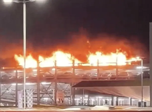 Man in 30s Arrested After Luton Airport Car Park Blaze Destroys 1,500 Cars and Grounds Flights