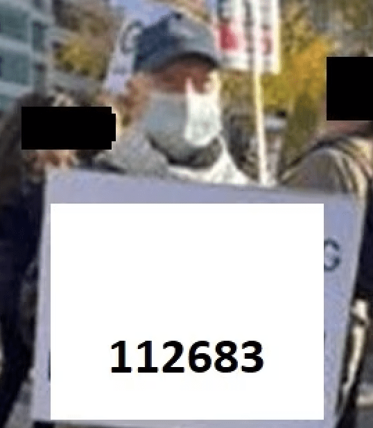 Met detectives have arrested a man on suspicion of inciting racial hatred at a protest after members of the public helped identify a man