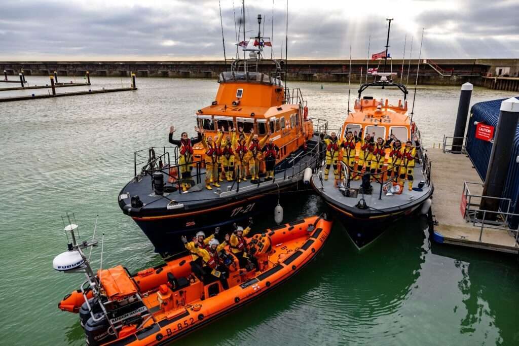 Brighton’s RNLI Flank Stations Celebrate with Carolers and Stormy Stan