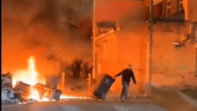 Leeds left to burn for hours as riot police are driven out and only returned to restore order at 1am after a patrol car is tipped over and bus torched on a night of shame