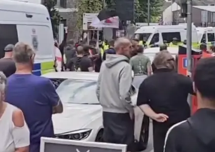 Britain’s Riot Carnage Deepens: Police Injured Amid Violent Clashes in Liverpool and Manchester