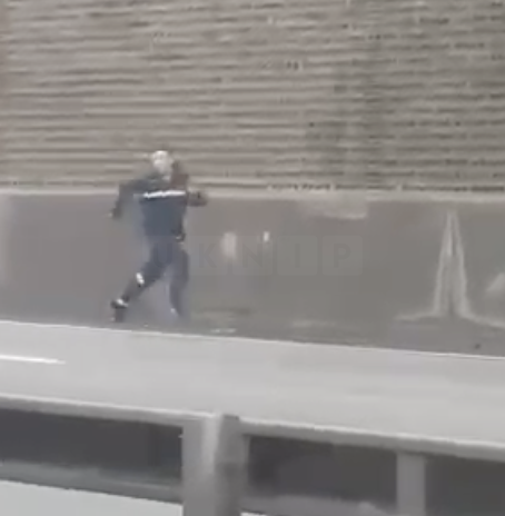 Moment Suspect Runs Down Busy Road and Scales Wall ‘Like Spider-Man’ in Bid to Escape Police