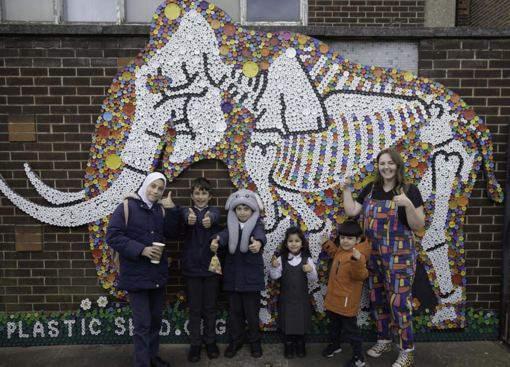Ilford Pupils Bring Prehistoric Mammoth Back to Life with Colourful Bottle-Top Mural