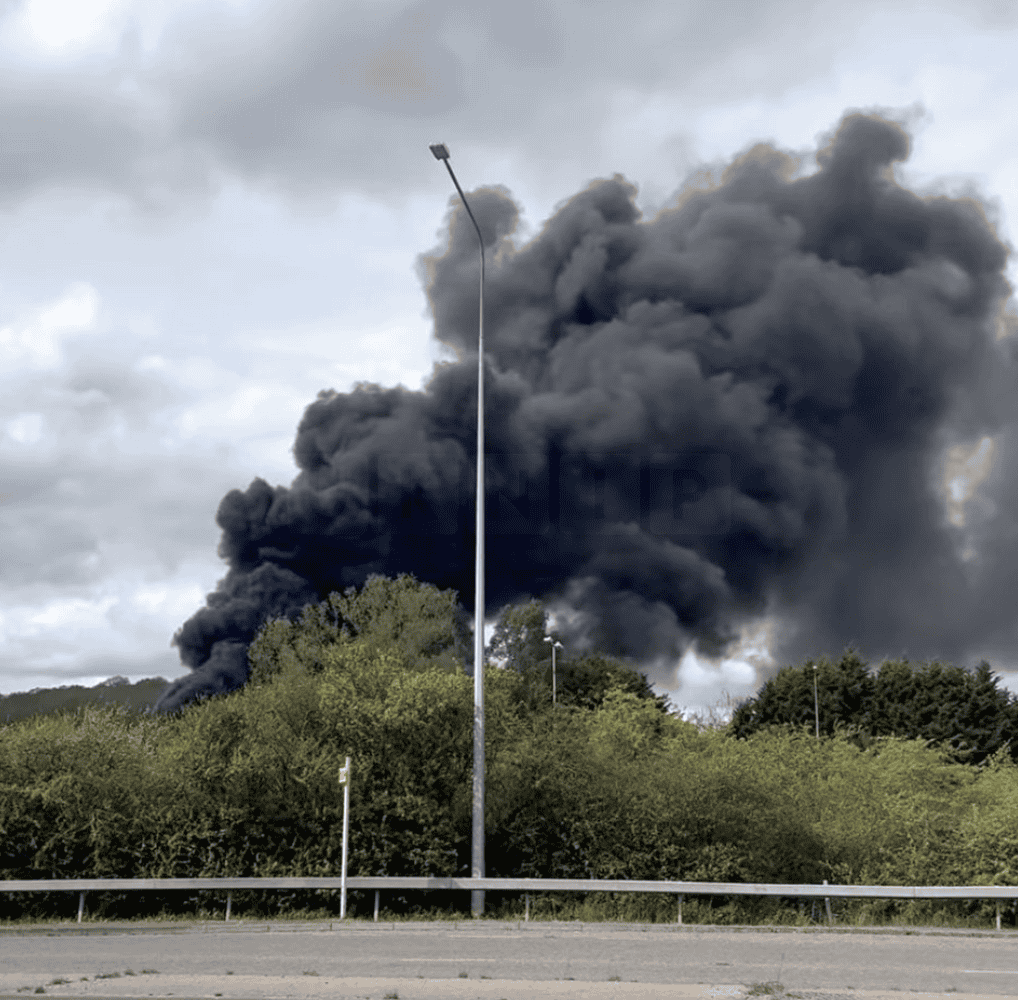 Major Fire Erupts at Industrial Site Near A13 in Basildon, Causing Traffic Disruption and Smoke Alert