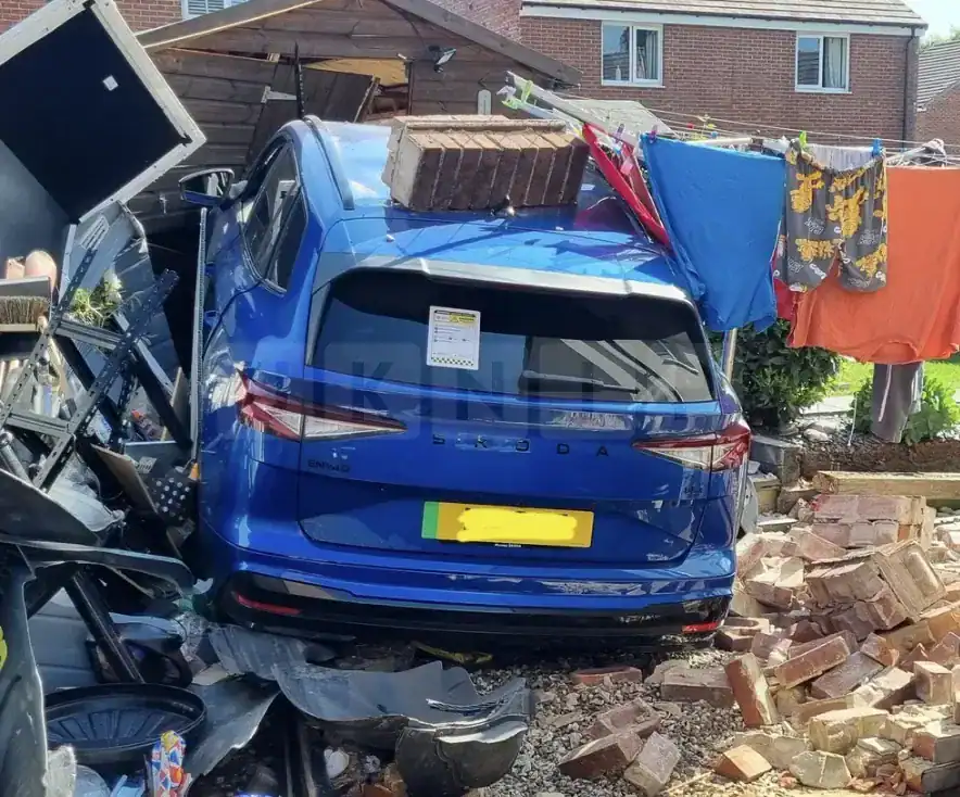 Electric Car Crashes Into Shed In Newton Abbot Garden — Fire Crews Make Scene Safe Electric Car Crashes Into Shed in Newton Abbot Garden — Fire Crews Make Scene Safe