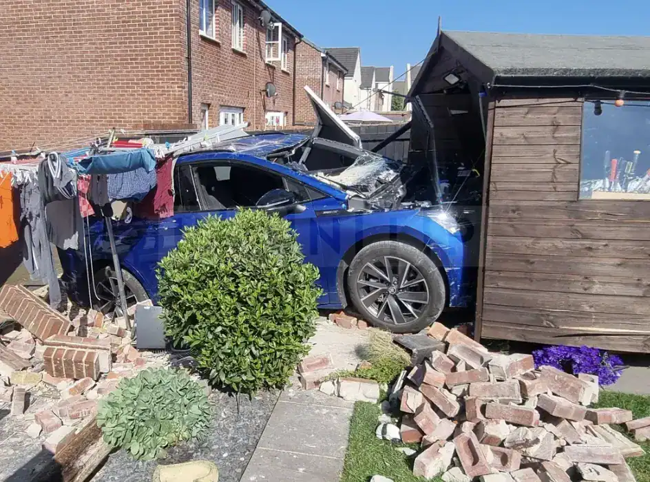 Electric Car Crashes Into Shed In Newton Abbot Garden — Fire Crews Make Scene Safe Electric Car Crashes Into Shed in Newton Abbot Garden — Fire Crews Make Scene Safe