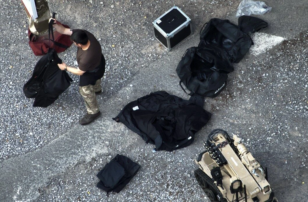 Multiple IEDs Found at Scene of Chainsaw Standoff as M20 and A20 Remain Close