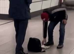 Scoundrel Snatches Busker’s Loose Change in Seconds
