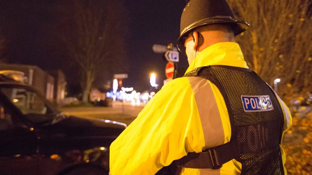 Police Investigating A Disturbance In The Street Have Made Two Arrests